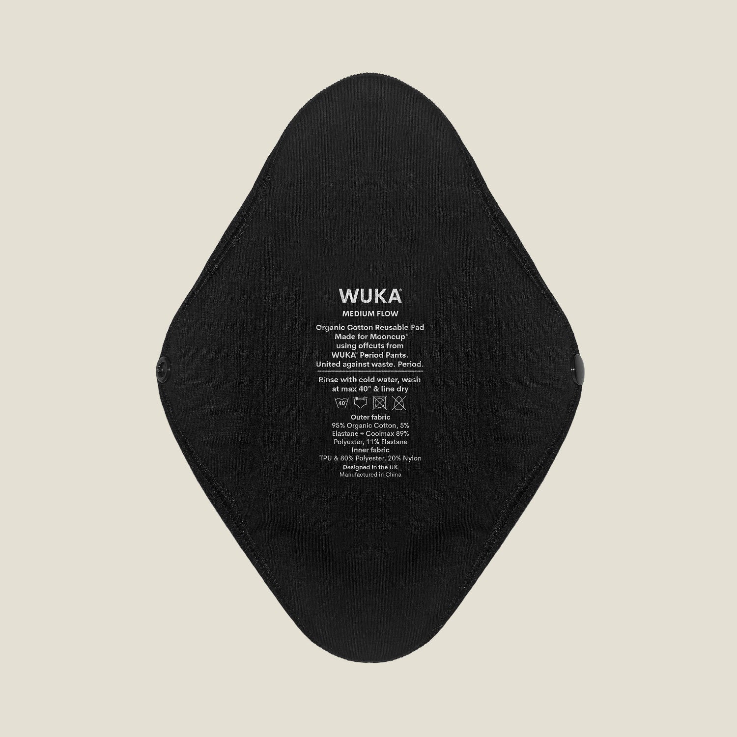 Flat lay of two black reusable period pads for medium flow, showing both front and back sides with snap closures and printed WUKA x Mooncup branding.