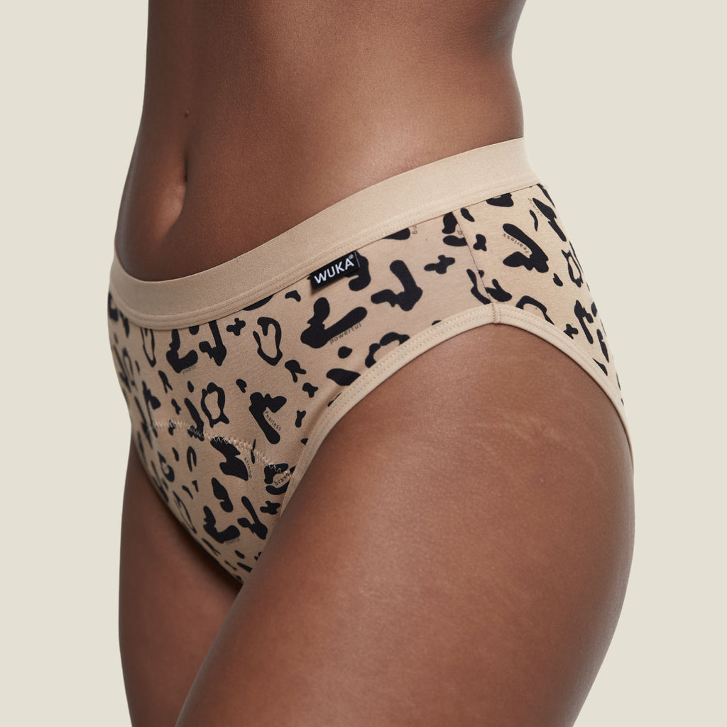 Side angle of WUKA Basics™ Leopard Print Bikini heavy flow period pants, highlighting stretch-fit comfort and stylish print detail