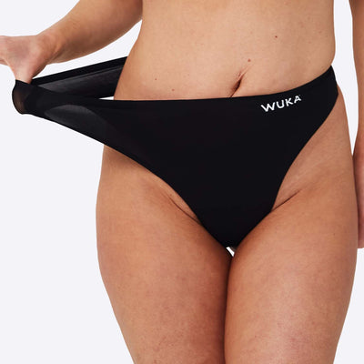 WUKA Stretch Thong Style Light to Medium Absorbency Black Colour Close up Size 1