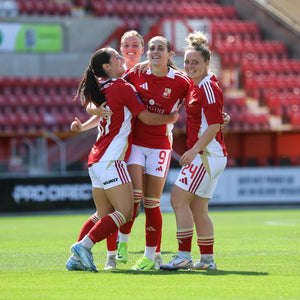 Swindon Town Women players celebrating on the pitch wearing WUKA period-proof shorts, sharing testimonials on confidence during matches
